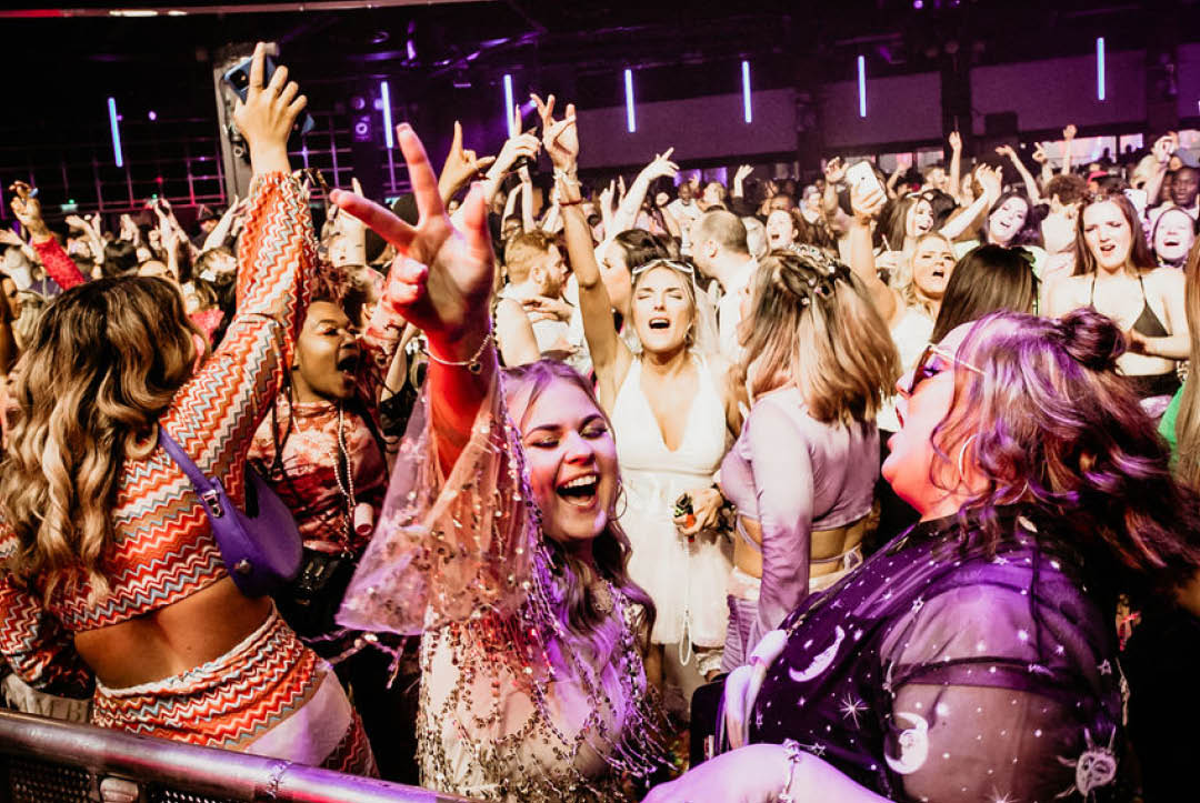Photo of women dancing at Glitterfest