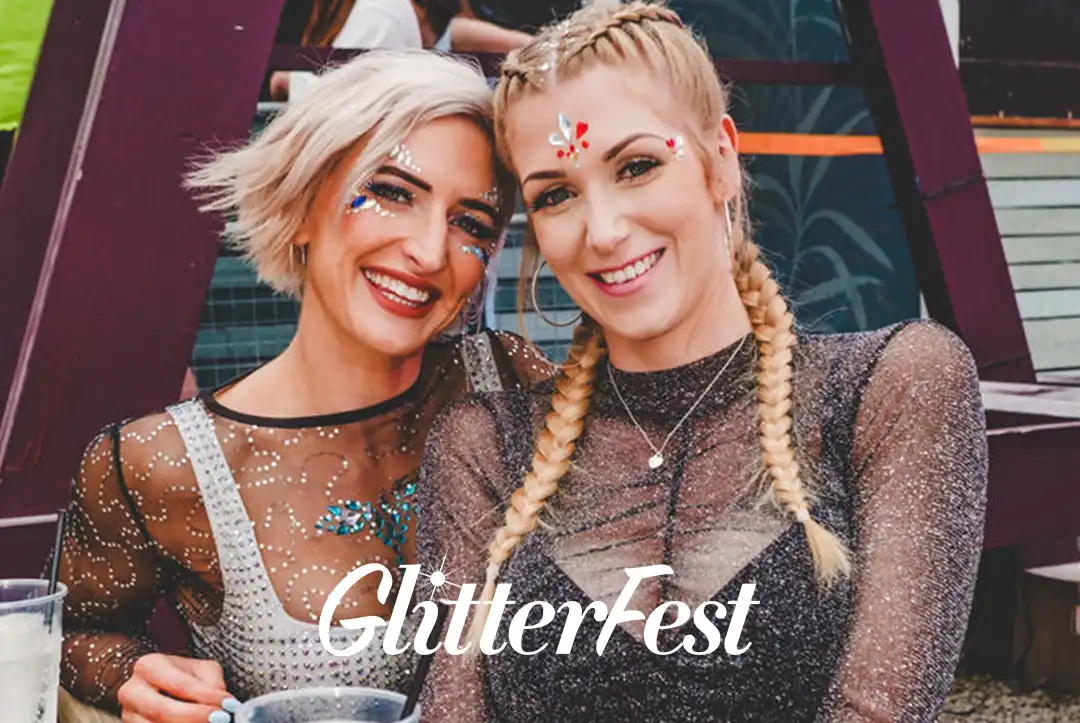 Glitterfest Leeds - Two women wearing sparkly outfits and glitter makeup at Glitterfest